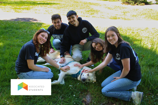 Student staff petting a dog