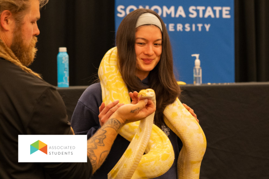 Student holding a snake.