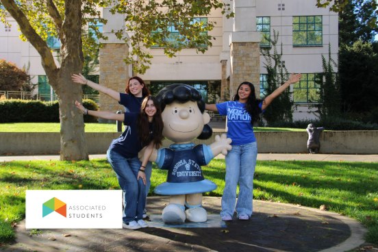 Students posing with the Lucy Statue