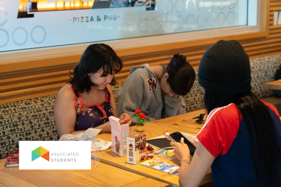 Students building mini lego sets in W&B.