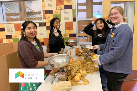 student volunteers packaging produce at a food bank