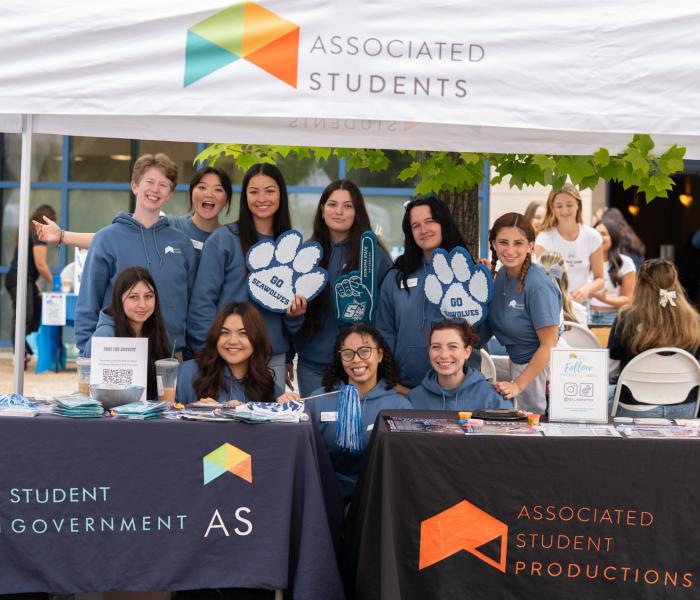 AS Students Staff at "AS" branded tents with Seawolf Pride merch.