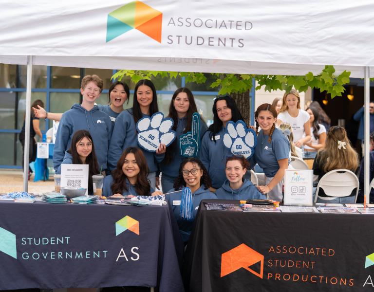 AS Students Staff at "AS" branded tents with Seawolf Pride merch.