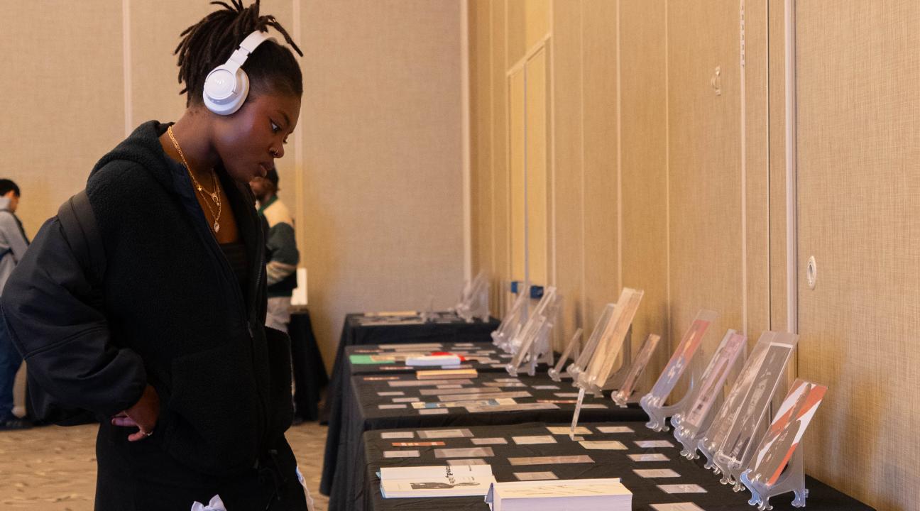 Student browsing an informational display.
