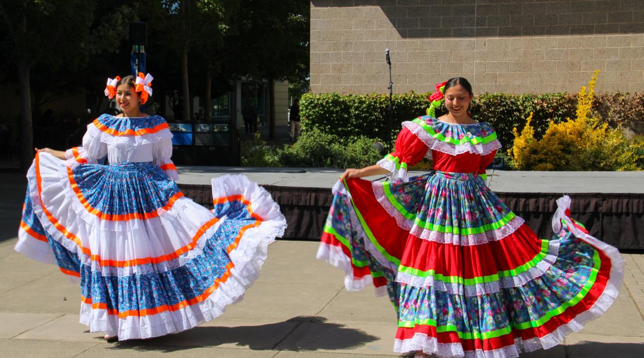 Two folklorico dancers in seawolf plaza.