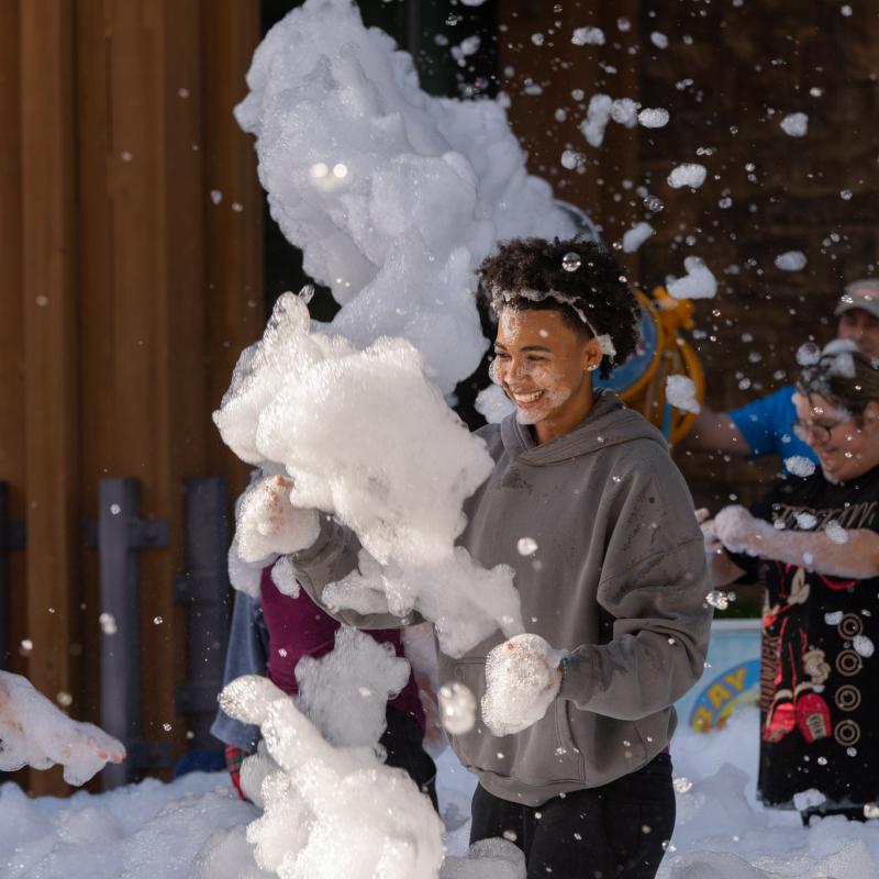Student playing in foam.