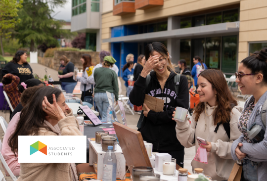 Students shopping at a market on campus.