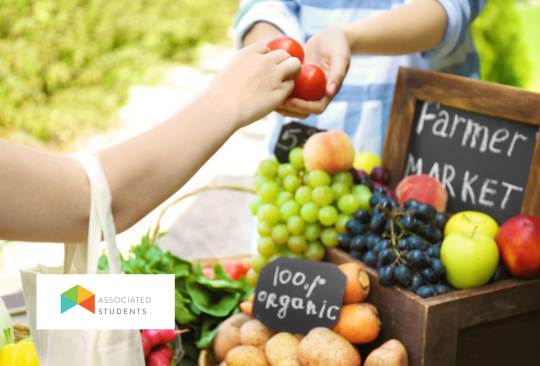 A farmers market stand selling organic produce.