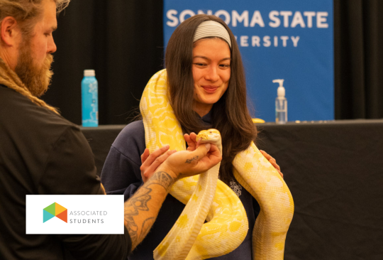 Student holding a snake.