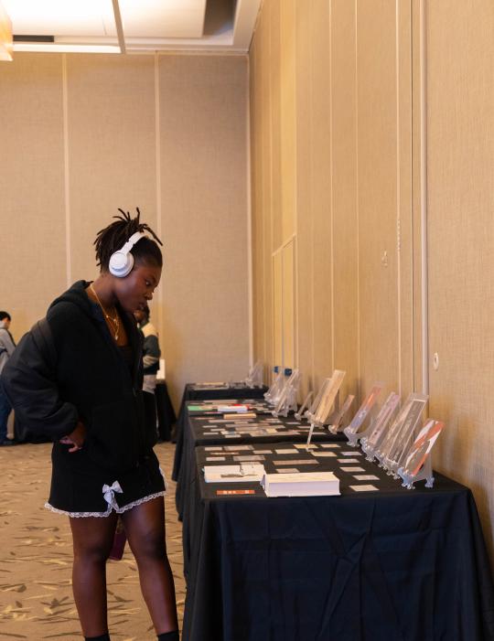 Student browsing an informational display.