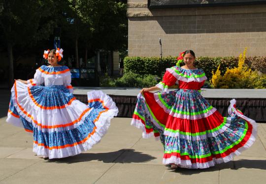 Two folklorico dancers in seawolf plaza.