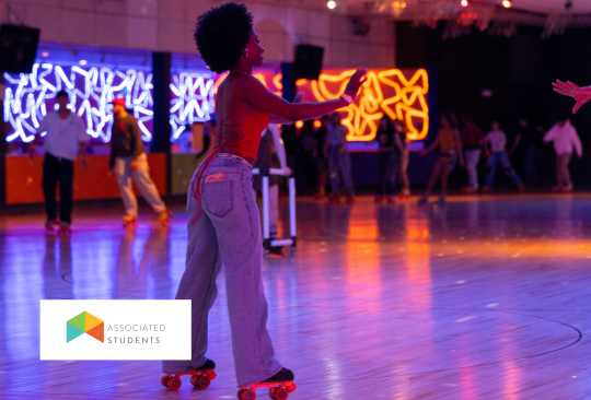 Students roller skating at Cal Skate roller rink.