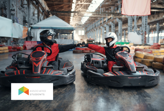 Go kart track with two racers lined up next to eachother.