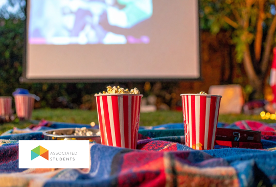 Outdoor projector movie setup and popcorn cups.