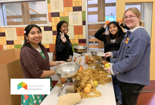student volunteers packaging produce at a food bank
