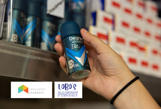 Hand holding out a deodorant. 