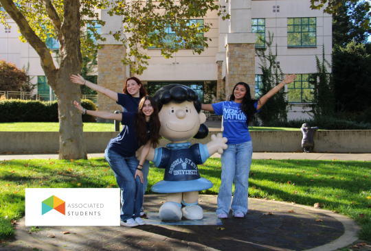 Students posing with the Lucy Statue